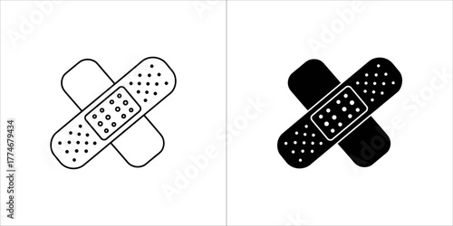 Two crossed band aids, one in black and white