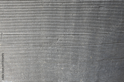 Monochromatic Texture: Close-Up of Repetitive, Parallel Grooves Creating a Fine-Lined Abstract Pattern