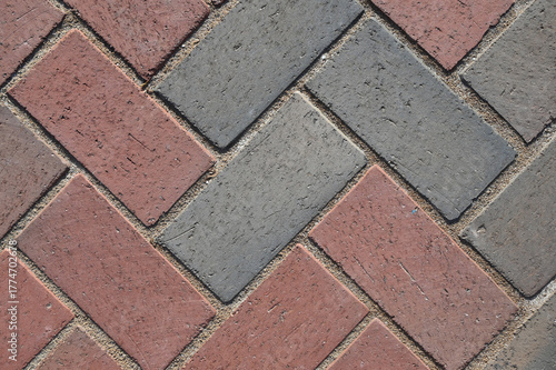 Close-Up View of Paver Bricks Laid in a Detailed Herringbone Pattern on a Walkway