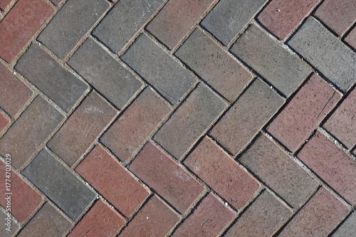 Close-Up View of Paver Bricks Laid in a Detailed Herringbone Pattern on a Walkway