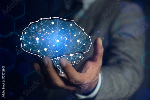 Businessman showing his virtual glowing brain on blue bokeh background. AI Technology, thinking. Smart thinking concept
