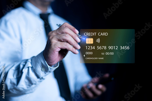 Businessman pay for products online via the Internet. Online via laptop and making payment with credit card
