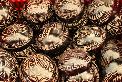 Indigenous bowls, handicrafts from the Brazilian Amazon, made from the fruit of the Cujite Crescentia, decorated with geoglyphs, for sale as souvenirs to tourists in the city of Belém, Pará, Brazil