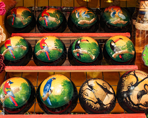 Indigenous bowls, handicrafts from the Brazilian Amazon, made from the fruit of the Crescentia Cujite, decorated with cave paintings for sale as souvenirs in Belém, Brazil