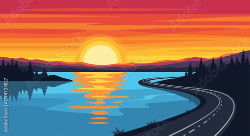 Scenic road curves alongside a tranquil river reflecting a vibrant sunset over distant mountains