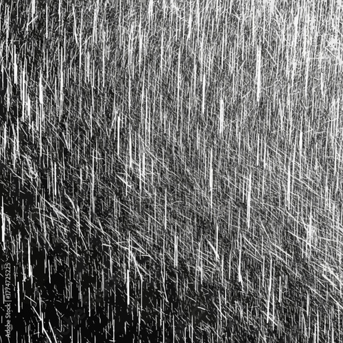 Dramatic black and white abstract texture of intense falling rain creating a moody, atmospheric backdrop for your designs