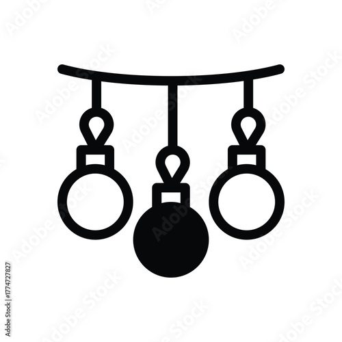 Three decorative baubles two hollow one filled hanging from a curved line