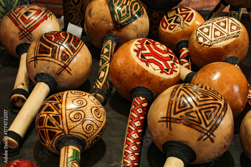 Indigenous maracas, handicrafts from the Brazilian Amazon, decorated with colorful geoglyphs, for sale at the Ver o Peso market, to tourists as souvenirs from the city of Belém, Pará, northern Brazil
