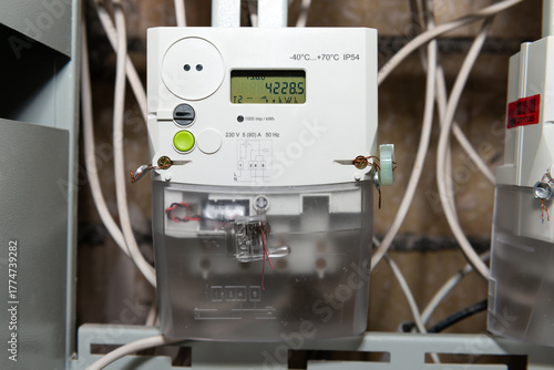 Obraz na płótnie Electrical meter with electrical power cables for house, digital electrical mete