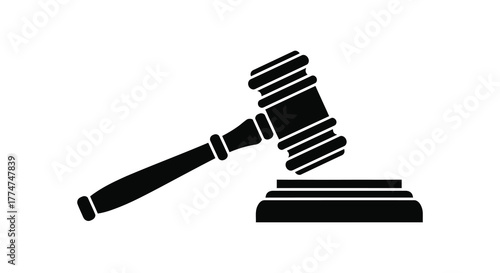 Black silhouette of a judge s gavel resting on a sounding block symbolizing justice and legal decisions
