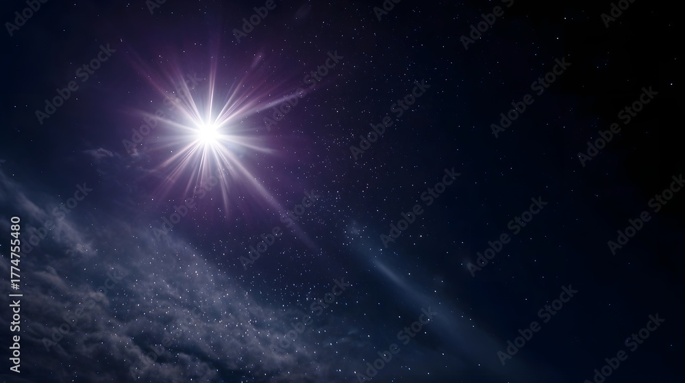 Obraz premium A brilliant star shines brightly in the dark star filled night sky casting radiant light rays