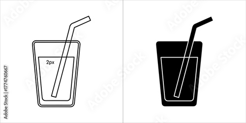 Glass of refreshing drink with straw