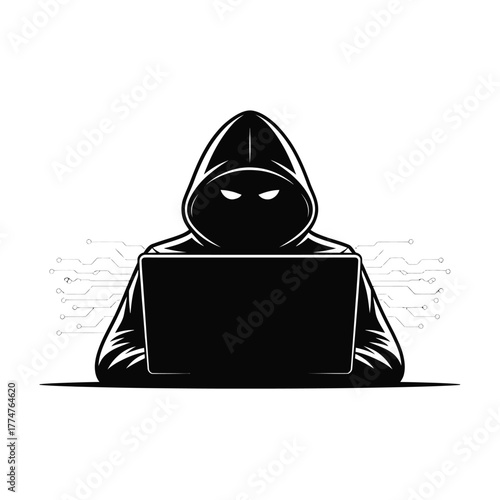 Anonymous hooded figure with glowing eyes using a laptop computer