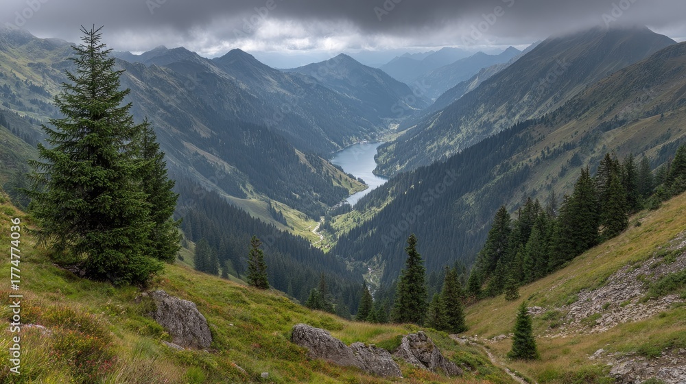 Fototapeta premium Mountain valley landscape with a tranquil lake nestled within the peaks.
