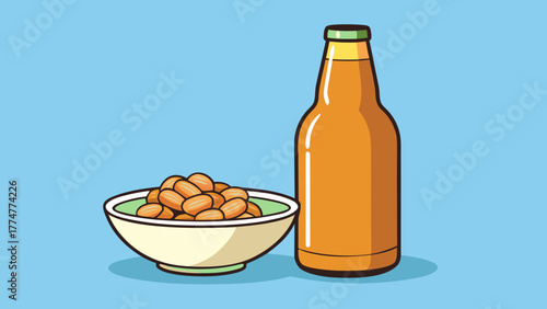 Beer bottle beside a bowl of peanuts against a blue backdrop