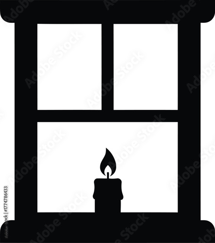 Silhouette of a lit candle in a window pane at night