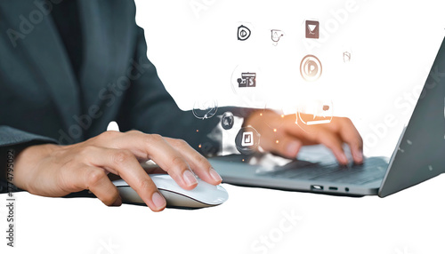 Person in suit uses laptop with floating icons, conceptualizing digital workflow