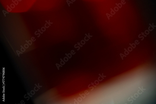 Abstract red light background design with glowing motion bubbles and dark texture pattern