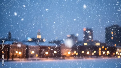 Wallpaper Mural Snow falling over city skyline at night with blurred lights and buildings in a winter scene Torontodigital.ca