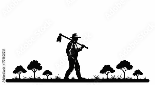Silhouette of a farmer walking with a hoe across his shoulder.