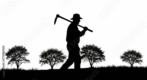 Silhouette of a farmer carrying a hoe on his shoulder.