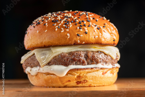 cheeseburger with mayonnaise. Bread, meat, cheese, mayonnaise.

