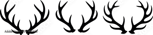 A collection of three black silhouettes of stag antlers against a white background.