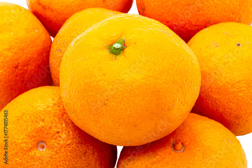 A macro shot of a pile of bright, ripe mandarins. An isolated object in PNG format with a transparent background, ideal for projects related to healthy eating, winter holidays, cooking, and any design