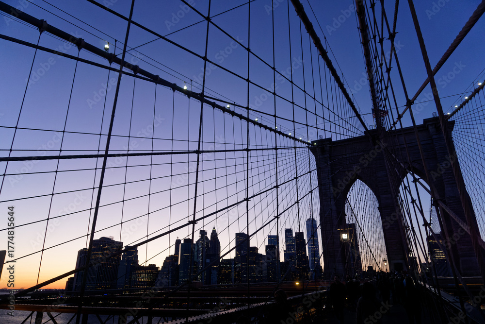 Obraz premium Brooklyn Bridge at Sunset with Blue Tones and Cable Web Pattern, New York City, USA