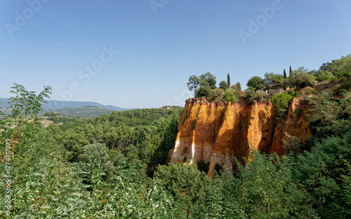 Orange Cliffs of Les Ocres de Roussillon with Forest, Provence, France