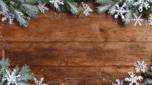 empty wooden table top with frame made of snowflakes and fir tree branches background for design for winter holidays christmas and new year top view flat lay with copy space