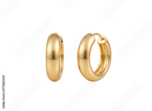 Golden Hoop Earrings: Exquisite close-up captures two radiant gold hoop earrings. Showcasing refined elegance and timeless appeal.