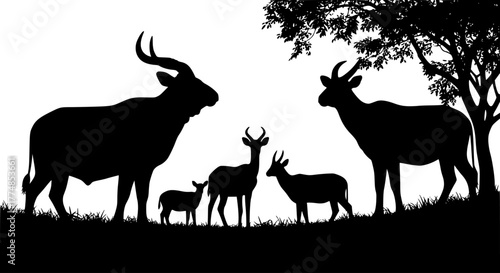 Silhouette of a family of antelopes under a tree.