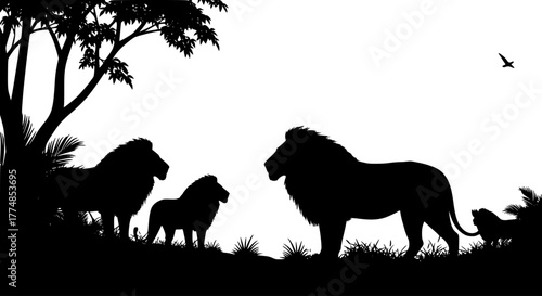 Silhouette of a lion family under a tree, with a bird flying above them.