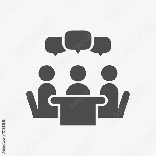 Three dark figures are conversing around a table during a business meeting