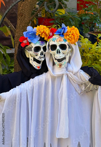 Day of the Dead spirit man and woman with flowers