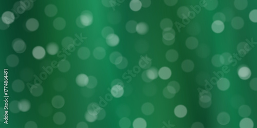 Abstract green bokeh background with soft focus circle lights and natural emerald tones.