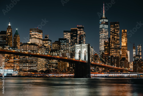 View across the East River to the Brooklyn Bridge with the New York skyline at night