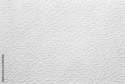Macro shot of a white or light gray surface with a pronounced, irregular, wavy texture shagreen. A versatile, clean, and minimalist abstract background, ideal for design, imitation of plastic.