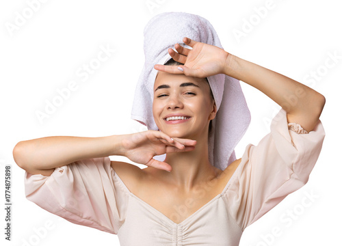 Portrait of young beautiful woman after bath. Beauty face of a cheerful attractive girl with towel on head.
