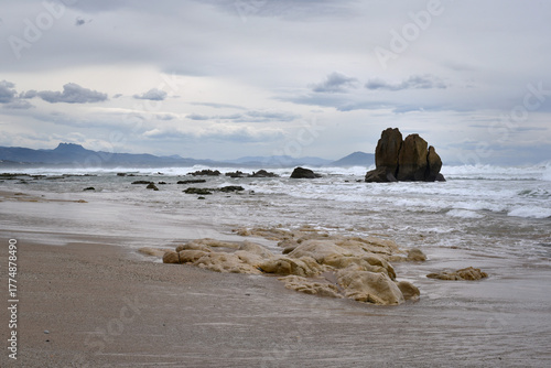 Beach Ilbarritz between Biarritz and Bidart on cloudy day in spring