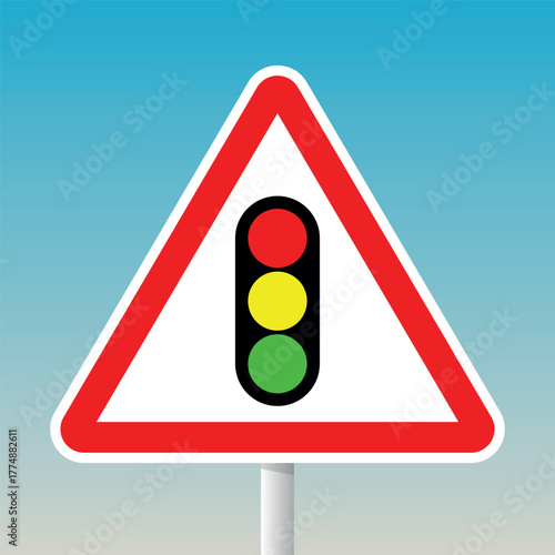 Traffic light warning road sign with red triangle and pole for signal alert and driving safety