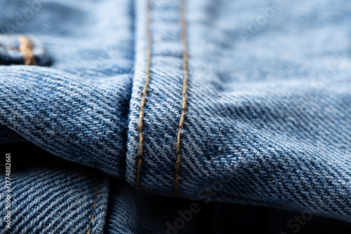 The denim is light blue. Denim background.