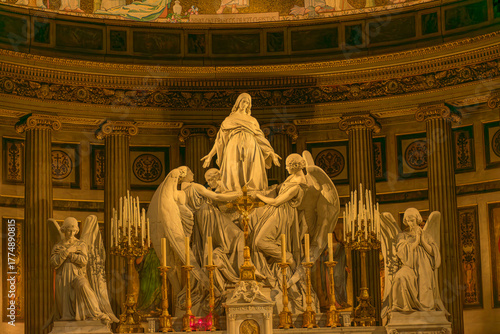 Sculpture of the Assumption of Mary Magdalene above the high altar of the Church of the Madeleine in Paris with angels and classical columns