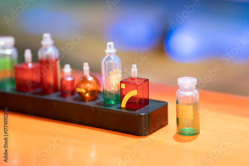 Colorful Glass Bottles With Colored Liquids On Black Tray For Laboratory Use In A Modern Science Lab