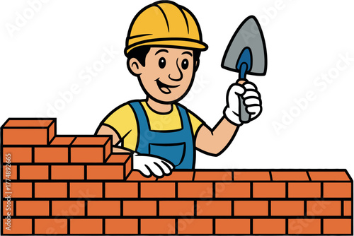 Smiling construction worker building a brick wall with a trowel and hard hat.