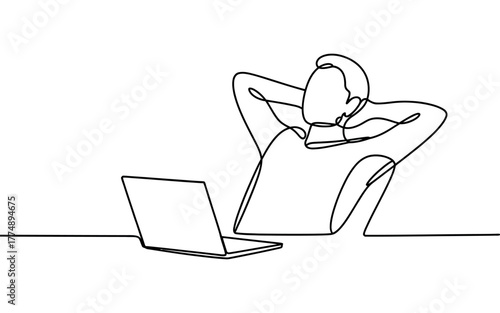 Relaxed person resting with hands behind head in front of laptop