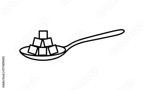 Sweetness in a spoon, sugar cubes piled high for a delightful treat.