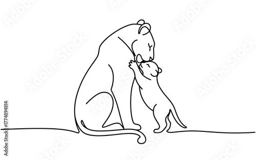 Tender moment of a mother lion nuzzling her playful cub with gentle affection