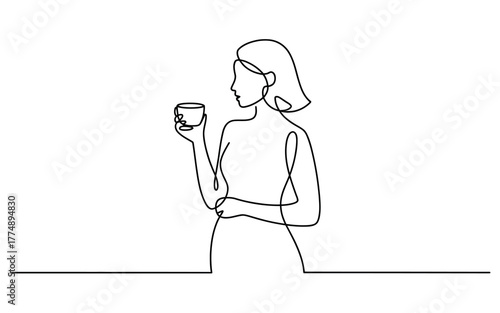 Woman enjoying a warm beverage with a peaceful moment